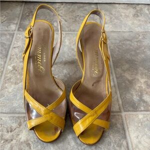 Vintage Emmebi yellow
Leather and clear vinyl sling back high heeled shoes.